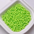 Macro shot of matte 4mm neon green spacer beads for DIY jewelry making in a white tray - Size 4 (5g/Approx 165pcs) / Emerald Green (11)