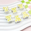 Close-up of colorful bear-shaped beads with pear patterns for DIY jewelry making - Pear Pattern Bear