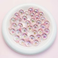Macro shot of 16mm pink iridescent acrylic beads for DIY jewelry making in a white bowl - 16mm / Transparent Light Pink