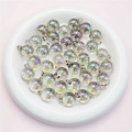 Macro shot of 16mm iridescent UV coated acrylic beads in a ceramic tray for DIY jewelry - 16mm / Transparent Gray