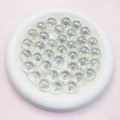 Detail view of 16mm transparent UV coated AB rainbow acrylic round beads in a white tray - 16mm / Clear White