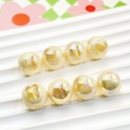 Macro shot of 16mm iridescent UV plated bunny beads for DIY jewelry making - 16mm / Yellow