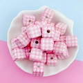 Macro view of 14mm pink houndstooth acrylic cube beads in a white floral bowl for DIY - 16 Size / Pink