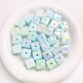 Macro shot of blue iridescent cube beads with dot design and center hole for jewelry making - Approx 14.5 Diameter (Sold per Piece) / Glow Blue
