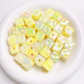 Macro shot of pale yellow pearlescent square cube beads for DIY jewelry making - Approx 14.5 Diameter (Sold per Piece) / Glow Yellow