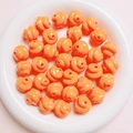 Macro shot of orange glossy poop emoji loose beads for DIY craft jewelry making - Diameter 16mm Hole 3mm / Orange