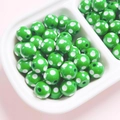 Detailed view of 12mm green polka dot resin beads in a tray for DIY jewelry making - Diameter 12mm (2.8mm Hole) / Dark Green