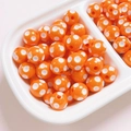 Detailed macro view of 12mm orange resin round beads with white polka dots for jewelry DIY - Diameter 12mm (2.8mm Hole) / Orange