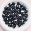 Macro shot of black glossy spiral pumpkin beads for DIY jewelry and phone chain making - Diameter 16mm Hole 3mm / Black