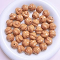 Brown spiral resin poop emoji beads for DIY jewelry and keychain making in a white tray - Diameter 16mm Hole 3mm / Brown