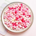 Mix of 6mm colorful matte acrylic round beads in a white ceramic dish for DIY crafts - 12mm (20 Pieces/Pack) / Rose Pink
