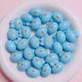 Detail of light blue acrylic cartoon bunny beads for DIY jewelry making on a plate - 20mm (2mm Aperture) / Glossy Blue