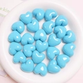 DIY craft set of glossy blue heart-shaped beads arranged in a white ceramic tray - 20mm / Blue