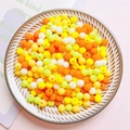 Macro shot of colorful 6mm acrylic matte round beads in a bowl for DIY jewelry making - Bright Orange Series