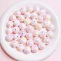 Leuchtende Acrylperlen mit Regenbogen-Aurora-Glanz für DIY-Schmuck in einer weißen Schale - 16mm Perle / Rosa
