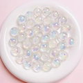 Macro shot of 16mm iridescent UV beads for DIY jewelry making in a white ceramic bowl - Diameter about 16mm Aperture about 2.5mm / White