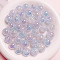 Detail of 16mm dual-color gradient UV beads with crackle effect in a white ceramic dish - Size approx 16mm, Hole approx 2.8mm / Light Blue