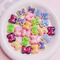 Macro shot of colorful macaron bow beads for DIY jewelry making in a ceramic bowl - 20x17mm / Random Mixed Colors