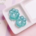 Macro shot of two pearlescent cat paw beads in pale green for DIY keychain making - Single Piece (Approx. 26mm) / Cyan