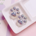 Macro shot of two pearlescent acrylic cat paw beads with iridescent purple and blue sheen - Single Piece (Approx. 26mm) / Gray