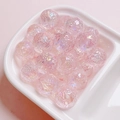 Macro detail of pink translucent planet beads with crackle texture for DIY jewelry making - 16mm / Light Pink