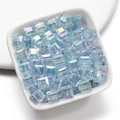 Macro shot of light blue cube acrylic beads with AB coating in a white ceramic dish - 8mm / Blue