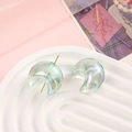 Macro view of iridescent crescent moon beads with aurora finish for DIY jewelry crafts - 22x25mm / Transparent Blue