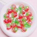 Macro shot of watermelon red and green gradient crackle glass heart beads in a ceramic dish - 18*22mm / Red