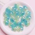 Macro view of gradient mint green heart acrylic beads with cracked foil and AB luster - 18*22mm / Green