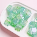 Macro shot of mint green acrylic square beads with crackle texture for DIY jewelry making - Diameter 15mm Hole 3.8mm / Green