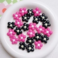 Macro detail of 20mm flower acrylic beads for DIY jewelry and phone chain making - Rose Red & Black