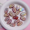 Macro view of cloud-shaped iridescent acrylic beads with cute text for DIY crafts - Luminous Coffee