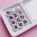 Detailed view of iridescent heart zircon bow charms for DIY jewelry and phone chains - Transparent Purple