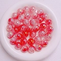 Nahaufnahme von 16mm rosa und roten Glasperlen mit Crackle-Effekt und AB-Beschichtung - 16mm / Rot Farbverlauf