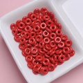 Close-up of vibrant red doughnut-shaped alloy beads for DIY jewelry and phone chains - Red
