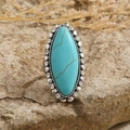 Vintage bohemian turquoise ring with rhinestone halo set on a textured stone background - Turquoise Rhinestone Border Style (HJ9434) / Antique Silver