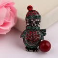Macro shot of a Christmas penguin brooch with colorful rhinestones and a red faux pearl - BR1351 Antique Silver Boy