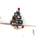 Detail shot of vintage silver Christmas tree brooch with red and green rhinestones - Antique Silver Red + Green