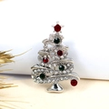 Detailed view of silver Christmas tree brooch with sparkling red and green crystals - Silver Red + Green