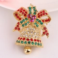 Detailed view of Christmas bell brooch with colorful rhinestones and gold finish - Gold