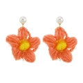 Handmade crochet flower earrings with orange petals and pearl studs on white background - Red