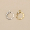 Macro detail of 18k gold plated round pendants with micro-pave cubic zirconia stones - Gold / Right Stone