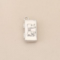 Close-up of a silver polished 18k gold plated square pendant with 3D bow design - Silver