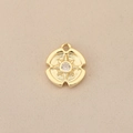 Close-up of gold plated 18k starburst pendant with sparkling center zircon crystal - Gold