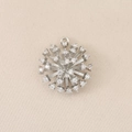 Macro detail of silver plated floral pendant with micro-pave cubic zirconia settings - Silver