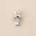Close-up of silver X-shaped pendant with heart zircon stone for DIY jewelry making - Knot Heart Style (PJ0237) / Silver