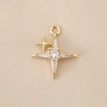 Detailed macro view of 18k gold plated cross star pendant with micro-set zircon crystals - Star Flare Style (PJ0244) / Gold