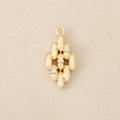 Macro detail of gold rhombus pendant with three inlaid zircons for DIY jewelry making - Gold