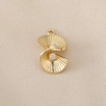 Macro detail of geometric 18K gold plated brass charm with shell texture and zircon stones - Gold