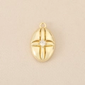 Macro shot of 18K gold plated oval pendant with cross pattern and center zircon stone - Gold